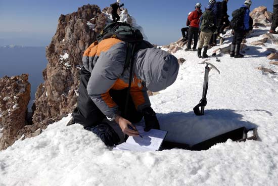Signing Mt Shasta's Summit Register